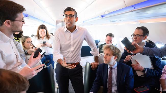 Rishi Sunak speaks with members of the media onboard a plane bound for San Diego. Picture: Getty Images