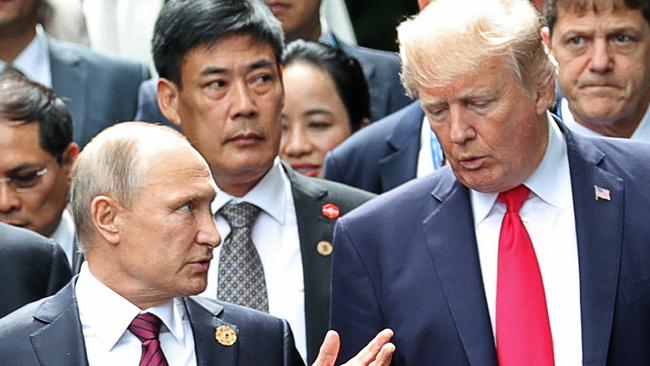 Russian President Vladimir Putin pictured with US President Donald Trump during the family photo session at the APEC Summit in Danang, Vietnam, on Saturday. Picture: Mikhail Klimentyev, Sputnik, Kremlin Pool/AP