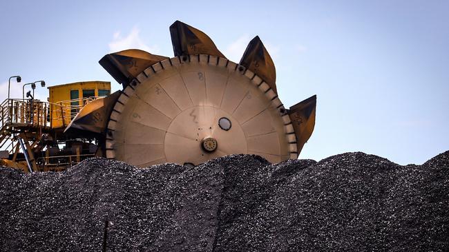 A bucket-wheel reclaimer next to a pile of coal at the Port of Newcastle, New South Wales. Much of the poorer world primarily wants to pull people out of poverty and improve their quality of life with cheap and reliable energy. Yet rich countries now refuse to fund anything remotely fossil fuel-related. Picture: David Gray/Bloomberg via Getty Images