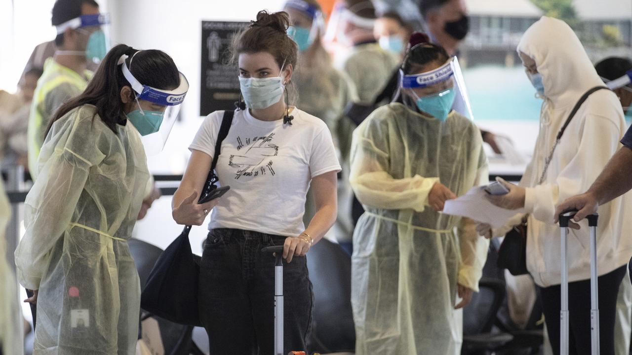 Passengers from a Sydney flight have their permits checked at Melbourne Airport on Sunday afternoon. Picture: NCA NewsWire / David Geraghty