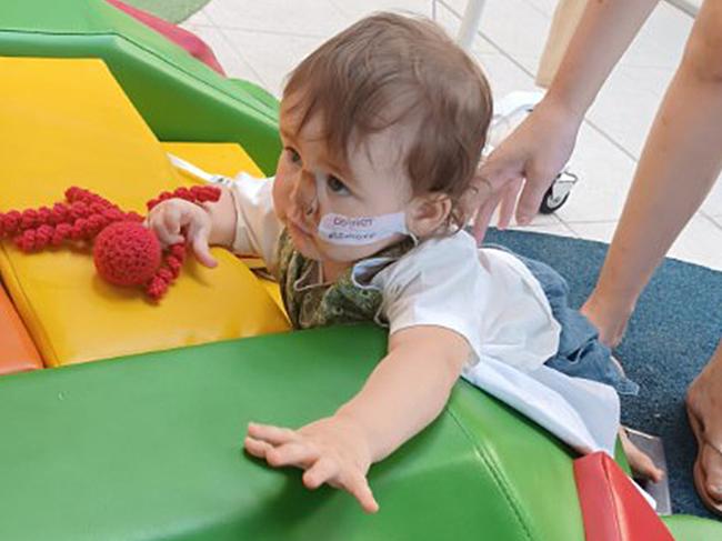 Amity Buchanan plays in Queensland’s Children’s Hospital as she recovers.