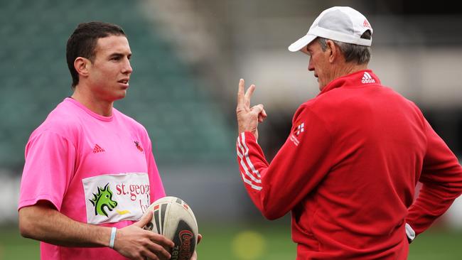 Darius Boyd chats with coach Wayne Bennett during Dragons training session in 2009.