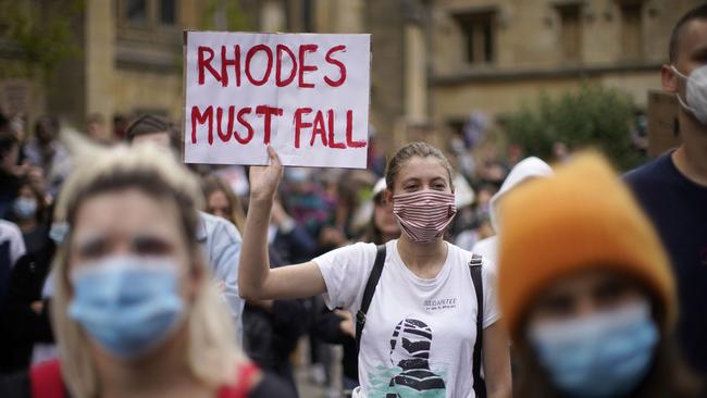 A demonstrator holds a placard as people gather outside University of Oxford's Oriel College during a protest in June, 2020. Picture: Getty Images