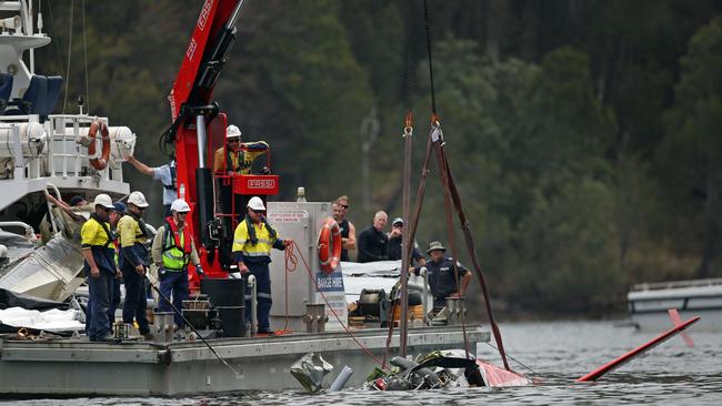 Salvage workers in Jerusalem Bay retrieve the seaplane. Picture: Richard Dobson.