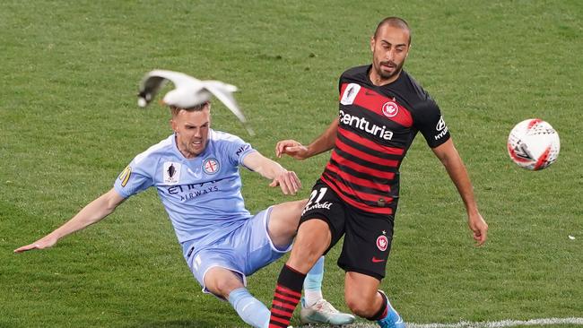 Craig Noone and Tarek Elrich compete for the ball during the FFA Cup quarter final match between Melbourne City FC and the Western Sydney Wanderers last September.