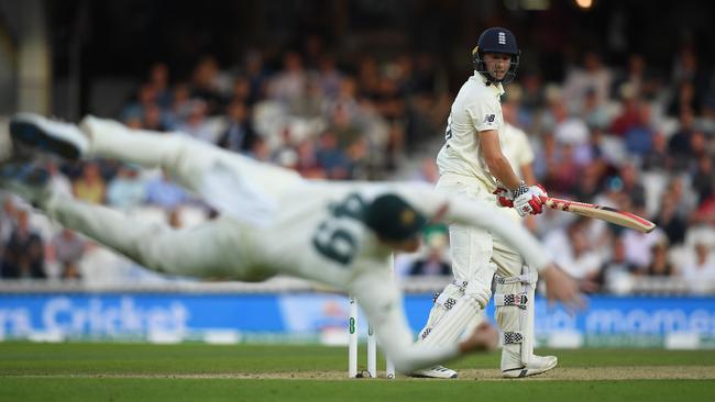 Steve Smith takes a superb catch off Chris Woakes late on day three. Picture: Getty Images