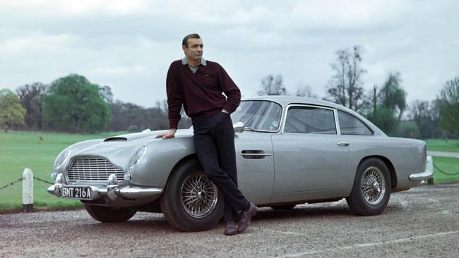 Sean Connery as James Bond with his Aston Martin in 1964.