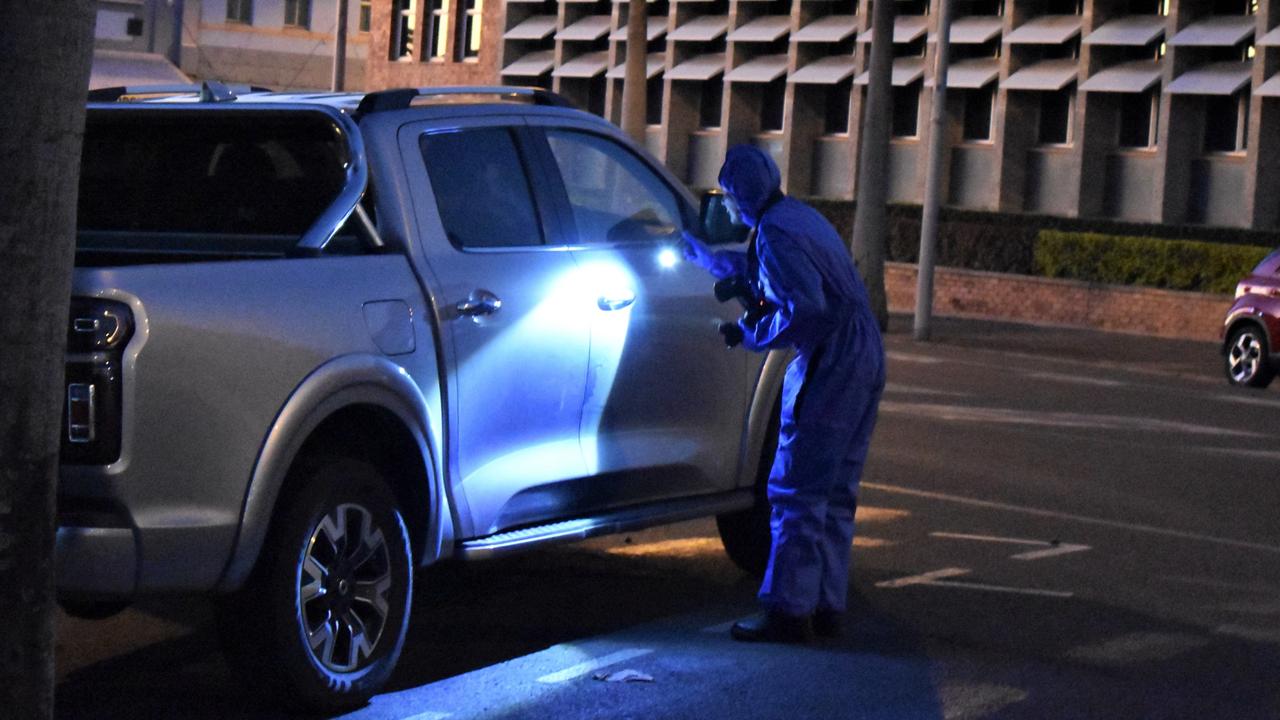 Scene of crime inspecting and photographing the ute Portmoresbey Cecil allegedly drove to the Rockhampton Police Station.