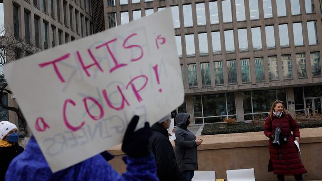 Protesters gather outside of the Theodore Roosevelt Federal Building headquarters of the U.S. Office of Personnel Management on February 03, 2025 in Washington, DC. (Photo by Kevin Dietsch / GETTY IMAGES NORTH AMERICA / Getty Images via AFP)