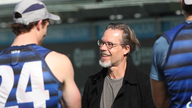 Actor Guy Pearce chats with Cats players at training ahead of this year’s AFL Grand Final. Picture: Alan Barber