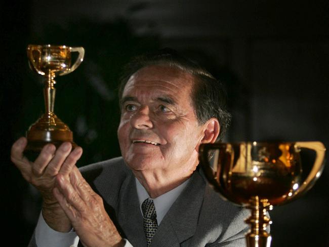 News.bcm.17.10.05 :  Melbourne Cup Tour Ladies of racing Lunch @ Tattersalls : Ray Seckrig 1961 Jockey of Cup winner Lord Fury recieves Replica Cup with the real thing in Foreground : PicGlennBarnes