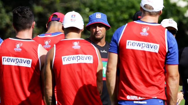 Coach Nathan Brown gets his troops in a huddle at training. .