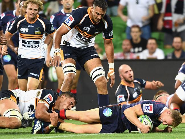 Helpless Brumbies look on after Reece Hodge crashes over.