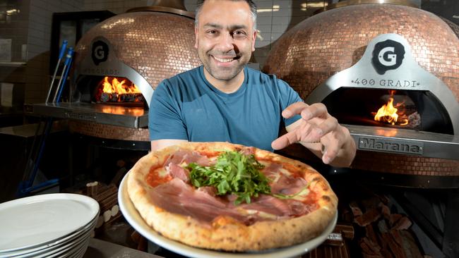 Johnny Di Francesco, owner of 400 Gradi in Brunswick East, is back at work and thrilled to be back in front of the pizza ovens again. Picture: Andrew Henshaw