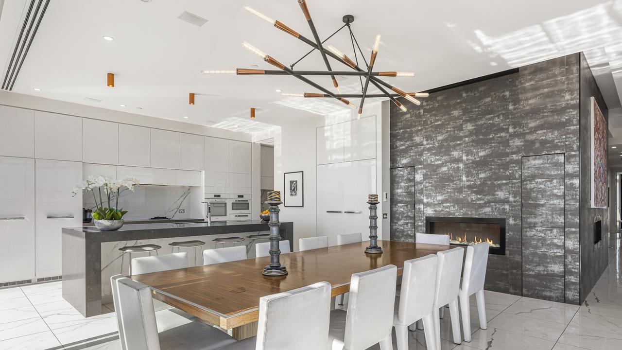 The kitchen includes Miele appliances, stone-topped waterfall-edged benches and a butler’s pantry.