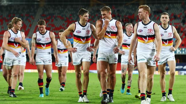 GOLD COAST, AUSTRALIA - JUNE 21: Crows leave the field after losing the round 3 AFL match between the Gold Coast Suns and the Adelaide Crows at Metricon Stadium on June 21, 2020 in Gold Coast, Australia. (Photo by Chris Hyde/Getty Images)