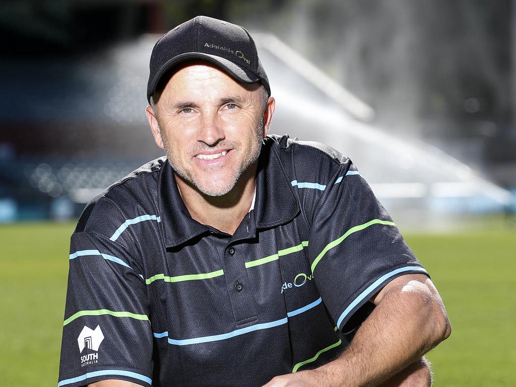 GRASS - Adelaide Oval head curator Damian Hough. Using a device to determine the moisture in the ground.  Picture SARAH REED