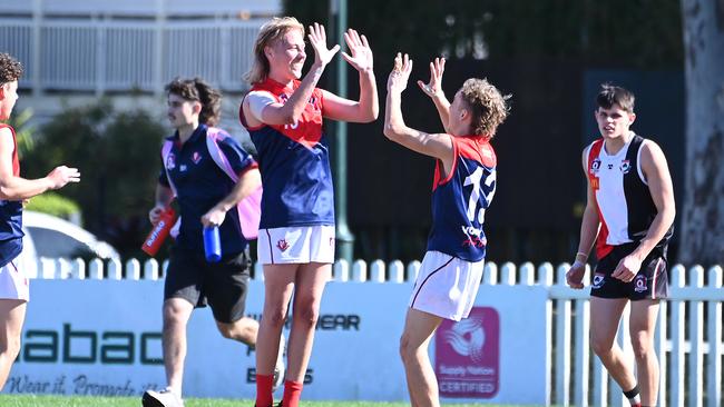 Surfers Paradise player celebrate in the 2023 QAFL colts season. Picture, John Gass