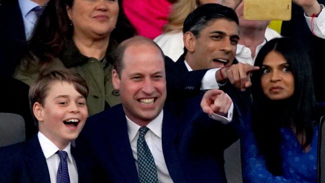 (L-R) Britain's Prince George of Wales, Britain's Prince William, Prince of Wales, Britain's Prime Minister Rishi Sunak and his wife Akshata Murty watch acts inside Windsor Castle grounds at the Coronation Concert.