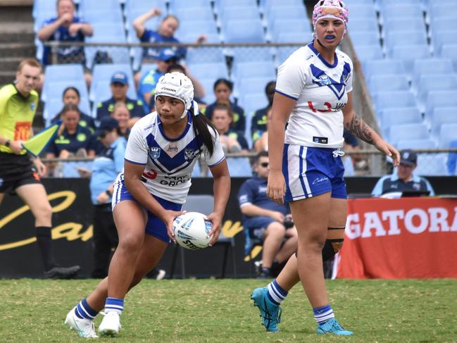 Fetuao Taito gets a pass away from dummy half as Trinity Tauaneai looks on. Picture: Sean Teuma