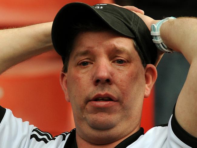 Fulham fans react after Fulham are relegated after losing 4-1 to Stoke City during the English Premier League soccer match between Stoke City and Fulham at the Britannia Stadium in Stoke On Trent, England, Saturday, May 3, 2014. (AP Photo/Rui Vieira)