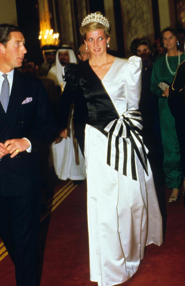 Diana’s Style: 1986 - Princess Diana, wearing a typically 80’s black and white dress designed by the Emmanuels, accompanied by Prince Charles, arrives at a dinner given by the Crown Prince in Saudi Arabia. Picture: Getty