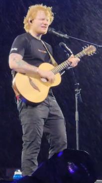 Ed Sheeran performs through rain as New Zealand braces for Cyclone Gabrielle