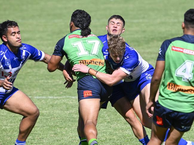 Chaev Kolone takes on the line. Picture: Martin Ollman