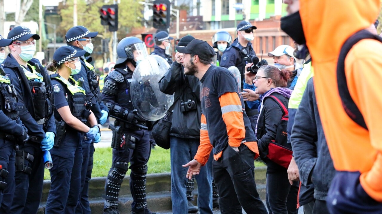 Victoria Police advance on anti-vax protesters outside state parliament
