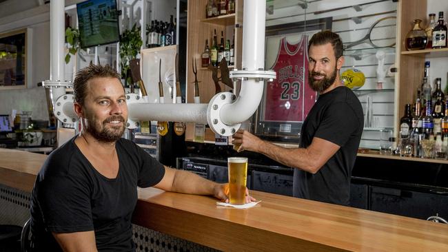 Harry's Steak Bistro and Bar owners Adam Haralampou and Pete Taylor having a beer at their new sports bar. Picture: Jerad Williams