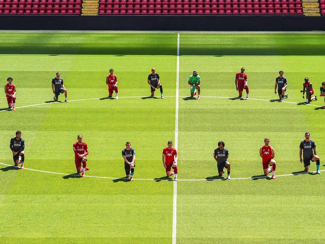 LIVERPOOL, ENGLAND - JUNE 01: (THE SUN OUT, THE SUN ON SUNDAY OUT) Liverpool players take a knee in memory of George Floyd at Anfield on June 01, 2020 in Liverpool, England. (Photo by Andrew Powell/Liverpool FC via Getty Images)