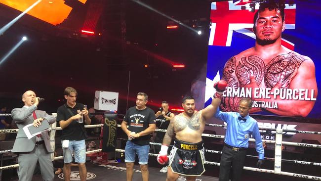 Toowoomba's Herman Ene-Purcell (right) celebrates his knockout win against Tanapat Vibulsuk.