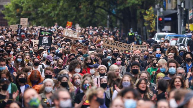 Huge crowds walk down Bourke Street in Melbourne’s CBD Picture: NCA NewsWire / Ian Currie