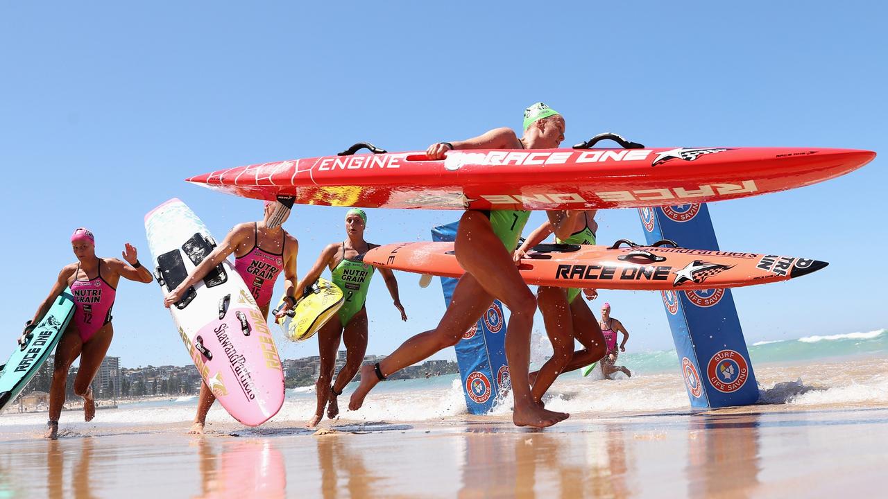 Competitors run around a marker in the board-leg during the 2023/24 Nutri-Grain IronMan & IronWoman Series at Manly Beach. Picture: Cameron Spencer/Getty Images