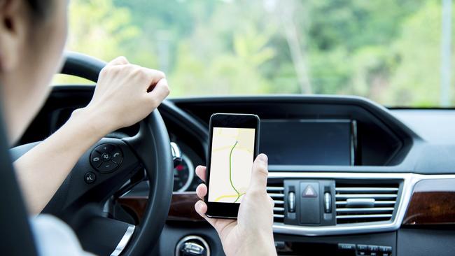 A woman caught using her phone while driving in Hoppers Crossing has pleaded with a magistrate to keep her licence. Picture: istock.