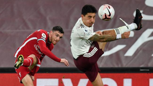 Liverpool defender Andrew Robertson crosses the ball past Arsenal’s Hector Bellerin