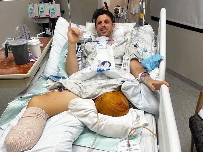 Royal Australian Navy clearance diver Dave Miln, of Seaforth, recovering in hospital after losing parts of both legs after throwing himself into the path of a moving snowplough to save his two daughters in northern California in December 2022. Picture: Supplied (GoFundMe)