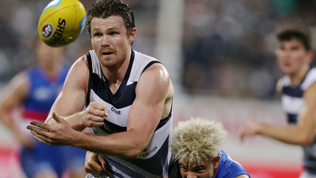 Patrick Dangerfield clears by hand. Picture: Michael Klein