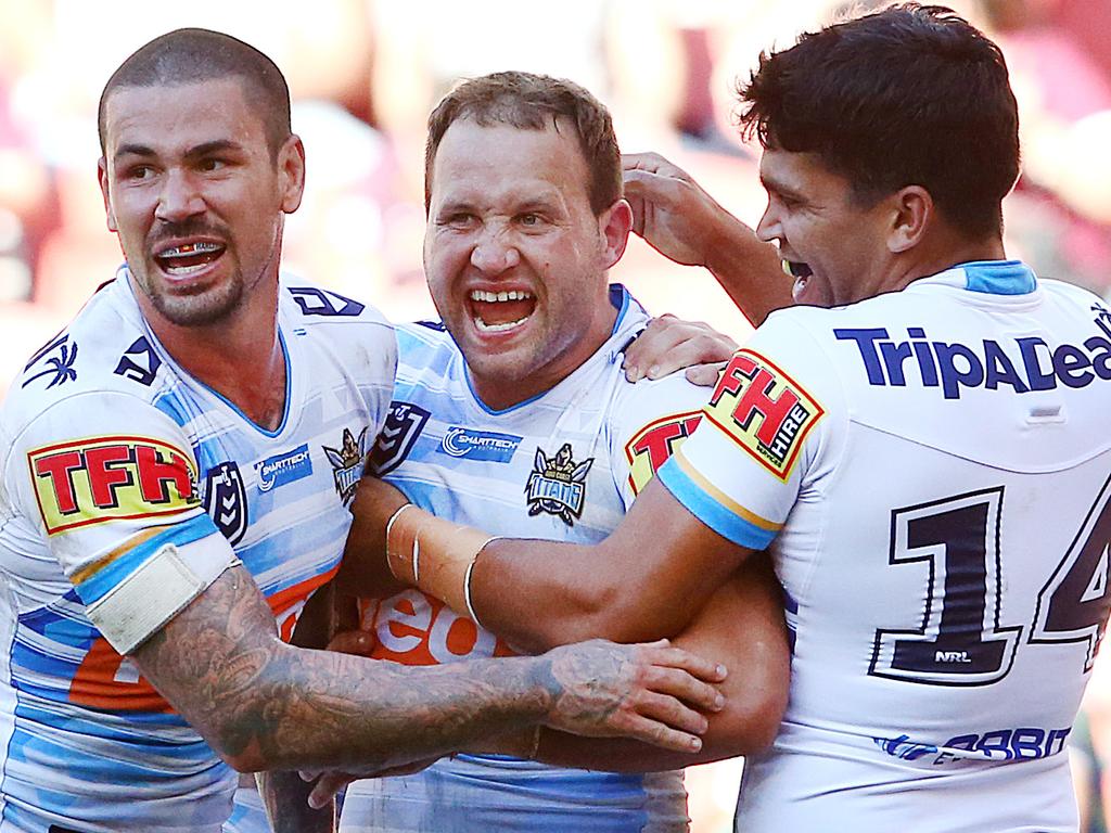 BRISBANE, AUSTRALIA - JUNE 09: Tyrone Roberts of the Titans (middle) celebrates a try with team mates during the round 13 NRL match between the Brisbane Broncos and the Gold Coast Titans at Suncorp Stadium on June 09, 2019 in Brisbane, Australia. (Photo by Jono Searle/Getty Images)