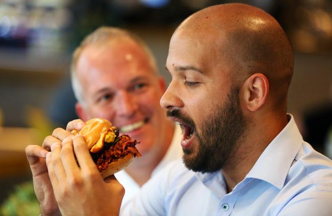 Executive chef Scott Shaw looks on as Ozren Vukelic prepares for the Ring of Fire burger. Picture: AAP Image/Angelo Velardo