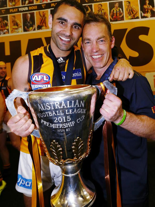 Former Power star Shaun Burgoyne with Alastair Clarkson and the premiership cup — one of three he has drank from at Hawthorn. Picture: Colleen Petch