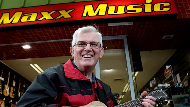 Arthur Ongley playing the ukulele outside Maxx Music store which is hosting the free classes.