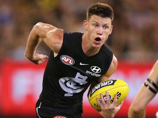 AFL Round1. Carlton vs Richmond at the MCG.   Sam Walsh of the Blues brushes past the tackle of Toby Nankervis of the Tigers 3rd qtr   . Pic: Michael Klein