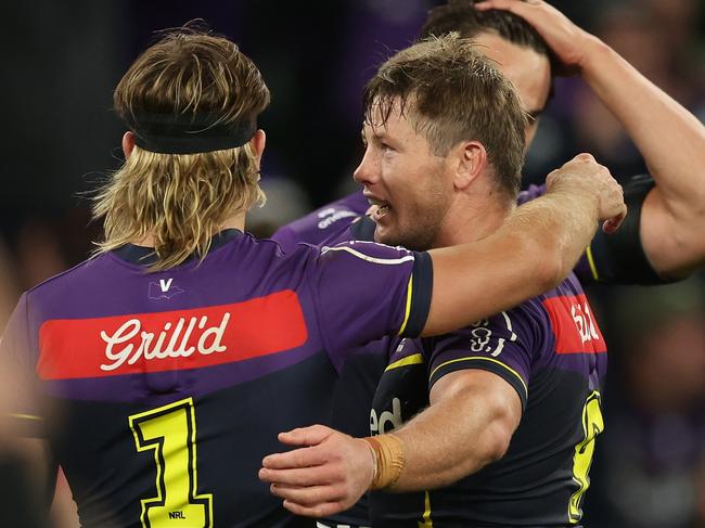 MELBOURNE, AUSTRALIA - APRIL 04:  Harry Grant and Ryan Papenhuyzen of the Storm celebrate winning the round five NRL match between Melbourne Storm and Brisbane Broncos at AAMI Park on April 04, 2024, in Melbourne, Australia. (Photo by Robert Cianflone/Getty Images)