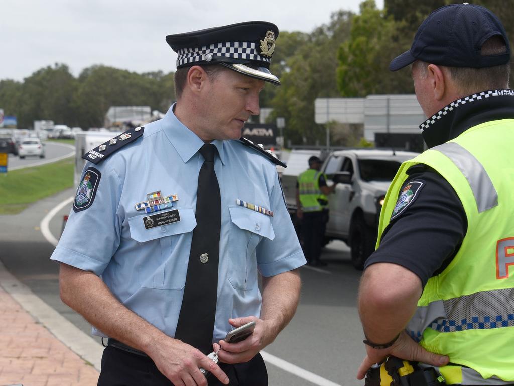 Chief Superintendent Mark Wheeler talks with a police officer at a Queensland border checkpoint. He says border barriers will be in place until January 8. Picture: NCA NewsWire/Steve Holland