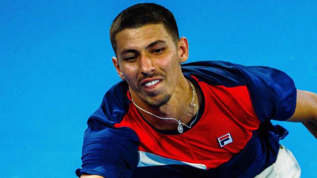 Australia's Alexei Popyrin hits a return against Russia's Roman Safiullin during their men's singles match at the Brisbane International tennis tournament in Brisbane on January 3, 2024. (Photo by Patrick HAMILTON / AFP) / --IMAGE RESTRICTED TO EDITORIAL USE - STRICTLY NO COMMERCIAL USE--