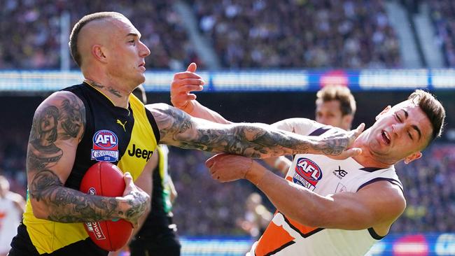 Dustin Martin fends off Tim Taranto in the first term. Pic: AAP