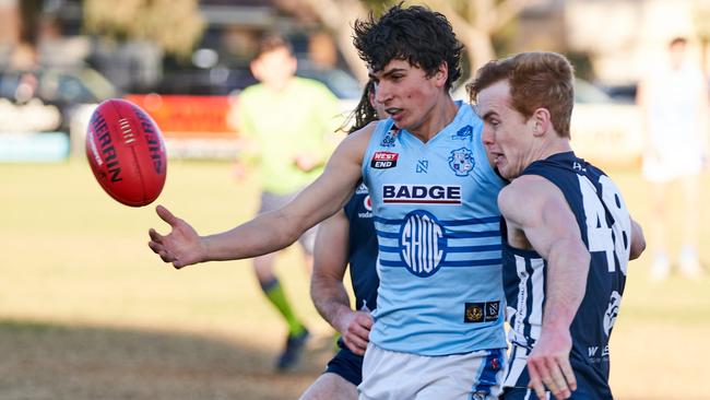 Dylan Simpson competes against Sacred Heart Old Collegians’ Luke Paperella. Picture: Matt Loxton