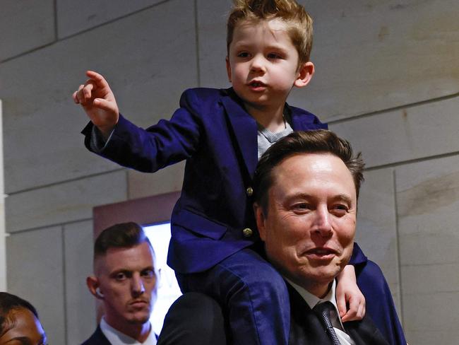 WASHINGTON, DC - DECEMBER 05: Tesla CEO Elon Musk, Co-Chair of the newly announced Department of Government Efficiency (DOGE) arrives with his son "X" on his shoulders at the U.S. Capitol before a meeting with members of the U.S. Congress December 05, 2024 in Washington, DC. Musk and DOGE Co-chair Vivek Ramaswamy are meeting with members of the U.S. Congress today about DOGE, a planned presidential advisory commission with the goal of cutting government spending and increasing efficiency in the federal workforce.   Anna Moneymaker/Getty Images/AFP (Photo by Anna Moneymaker / GETTY IMAGES NORTH AMERICA / Getty Images via AFP)