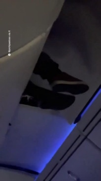 Man stuck in overhead locker on plane